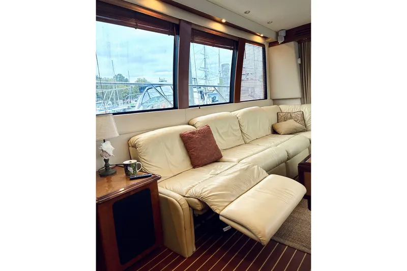 Slide: The Image of Luxurious interior of 2004 Carver 570 Voyager Pilothouse with cream leather seating. - 26