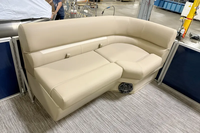 Slide: The Image of Beige seating on a 2027 Godfrey EX 2086 SBX boat, featuring integrated speaker. - 2