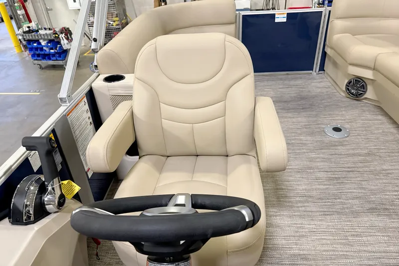 Slide: The Image of Captain's chair and steering wheel of 2027 Godfrey EX 2086 SBX pontoon boat. - 7