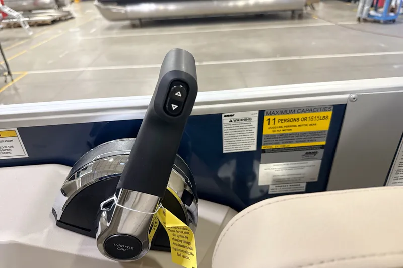 Slide: The Image of Throttle control of 2027 Godfrey EX 2086 SBX boat, showing capacity warning label. - 6