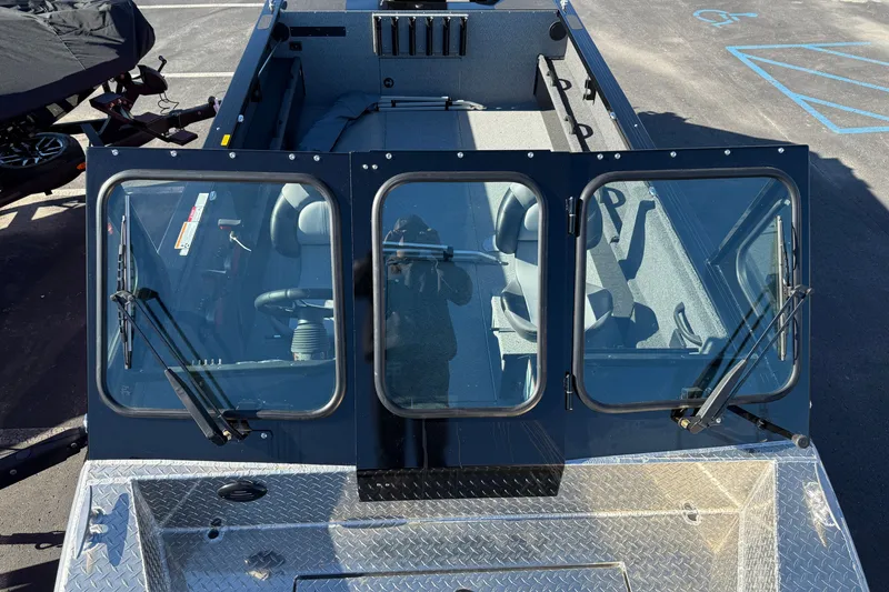 Slide: The Image of 2026 Crestliner 2050 Commander Elite boat with windshield and seating, viewed from above. - 6