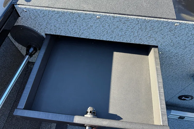 Slide: The Image of Open storage compartment in 2026 Crestliner 2050 Commander Elite boat, showcasing interior design. - 16