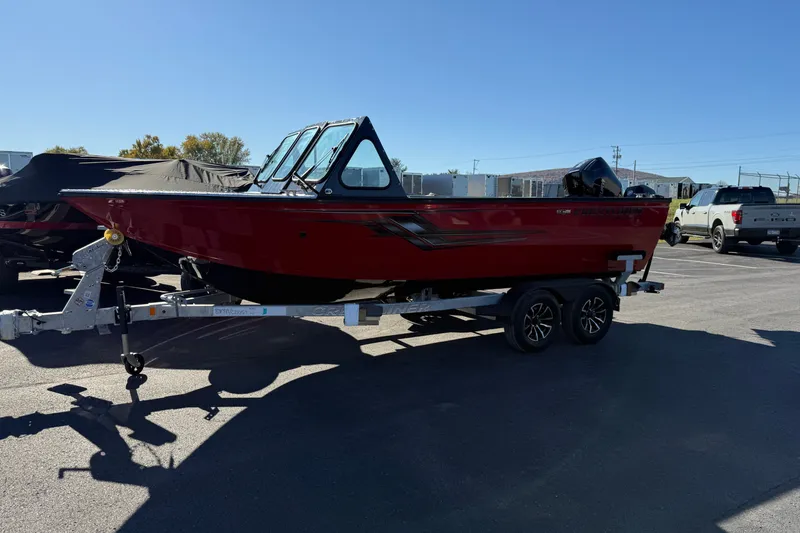 Slide: The Image of 2026 Crestliner 2050 Commander Elite boat on trailer in parking lot. - 3