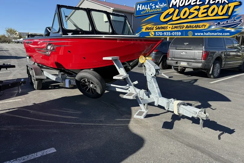The Image of 2026 Crestliner 2050 Commander Elite boat on trailer at dealership closeout sale. - 0