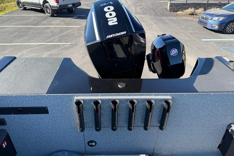 Slide: The Image of 2026 Crestliner 2050 Commander Elite boat with Mercury outboard motors in a parking lot. - 13