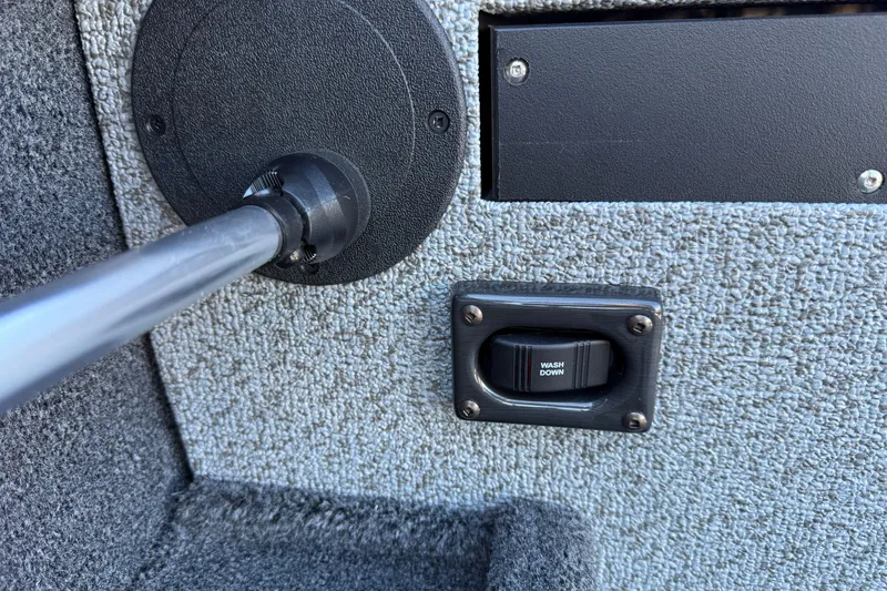 Slide: The Image of 2026 Crestliner 2050 Commander Elite interior with washdown switch and textured panel. - 15