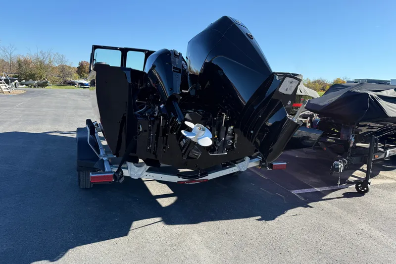 Slide: The Image of 2026 Crestliner 2050 Commander Elite boat on trailer, rear view, outdoors. - 21