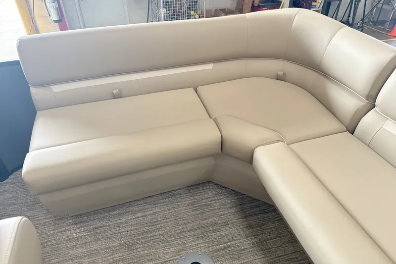 Slide: The Image of Beige leather seating in a 2027 Godfrey EX 1880 CX boat interior. - 6