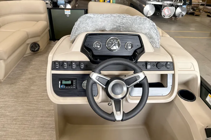 Slide: The Image of 2027 Godfrey EX 1880 CX boat dashboard with steering wheel and control panel. - 8