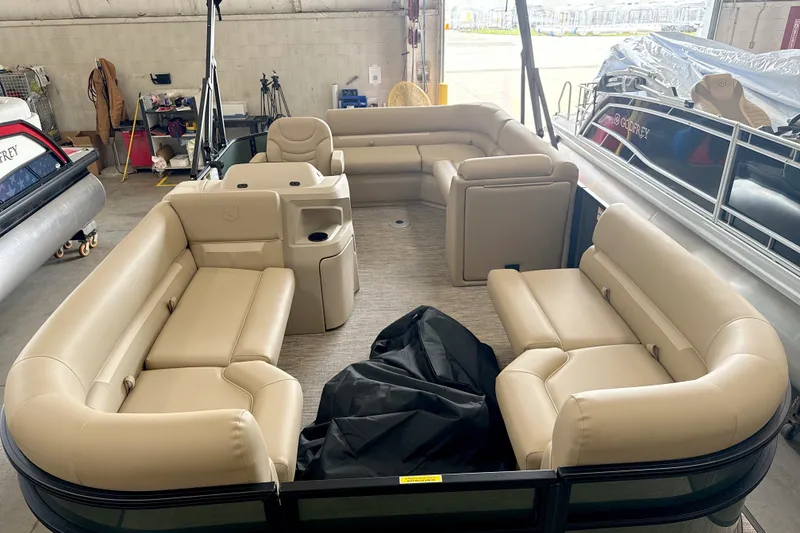 Slide: The Image of Luxurious 2027 Godfrey EX 1880 CX pontoon boat interior with beige seating. - 2