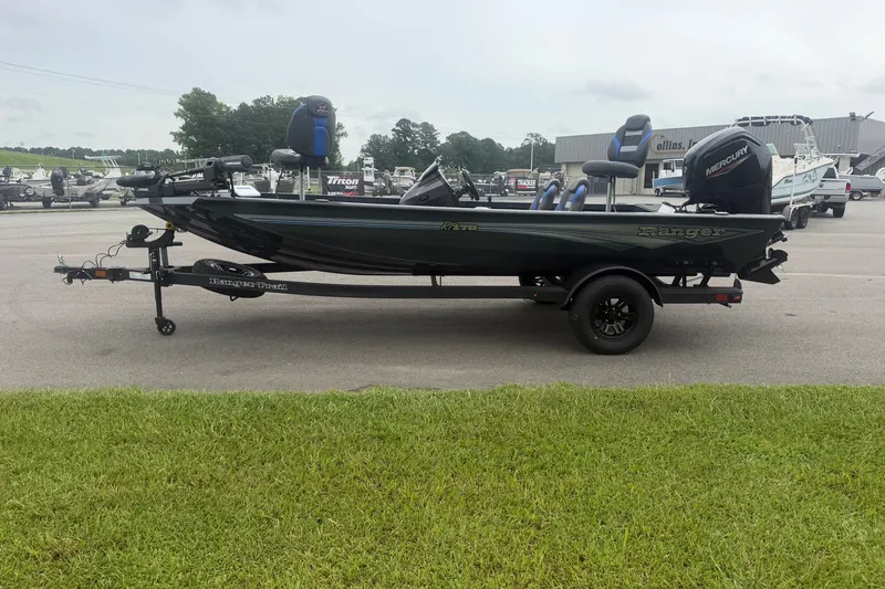 Slide: The Image of 2027 Ranger RT178 boat on trailer, parked outdoors, side view. - 4