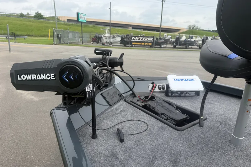 Slide: The Image of 2027 Ranger RT178 boat with Lowrance equipment on deck, parked outdoors. - 7
