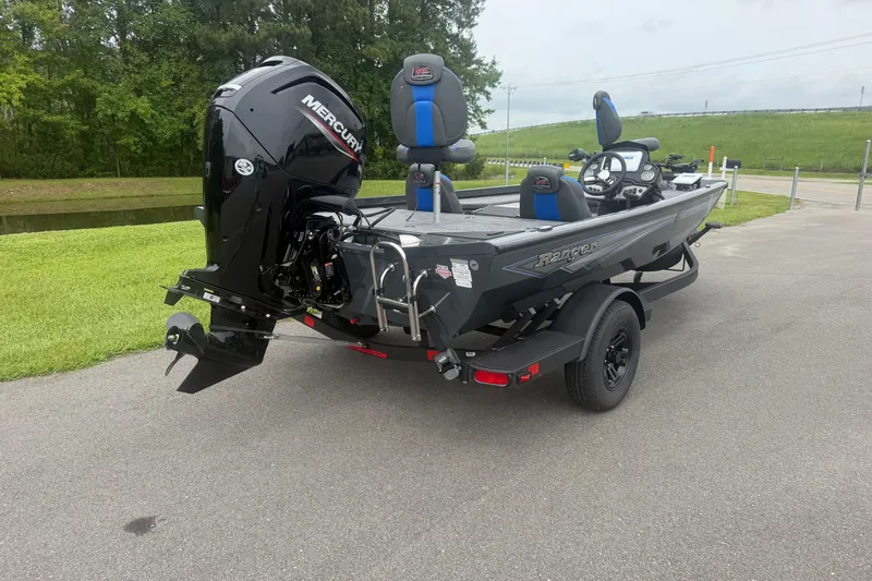 Slide: The Image of 2027 Ranger RT178 boat with Mercury engine on a trailer, parked outdoors. - 6