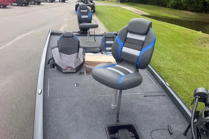 Slide: The Image of 2027 Ranger RT178 boat interior with gray and blue seating on a trailer. - 9