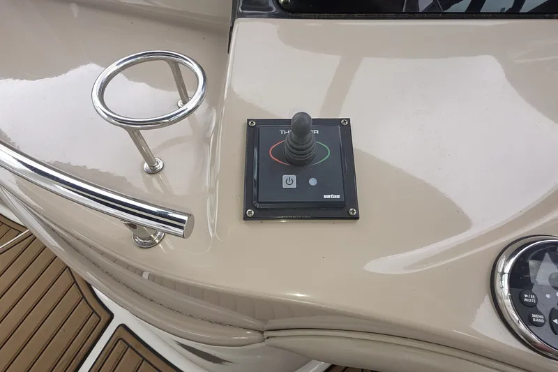 Slide: The Image of Control panel on 2004 Sea Ray 420 Sundancer yacht deck with joystick and railing. - 13