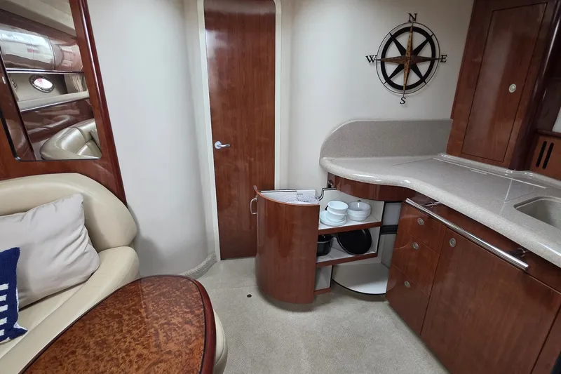 Slide: The Image of Luxurious interior of 2004 Sea Ray 420 Sundancer yacht with elegant wood cabinetry. - 25