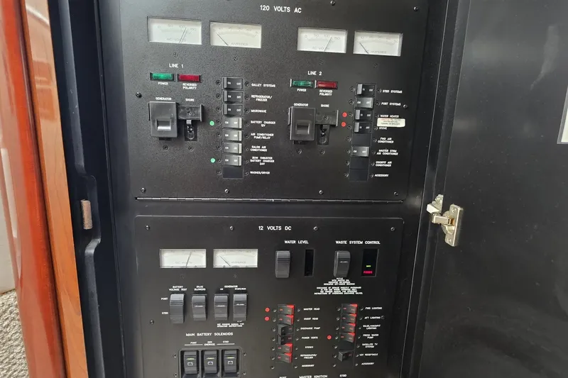 Slide: The Image of Electrical control panel on a 2004 Sea Ray 420 Sundancer yacht. - 30