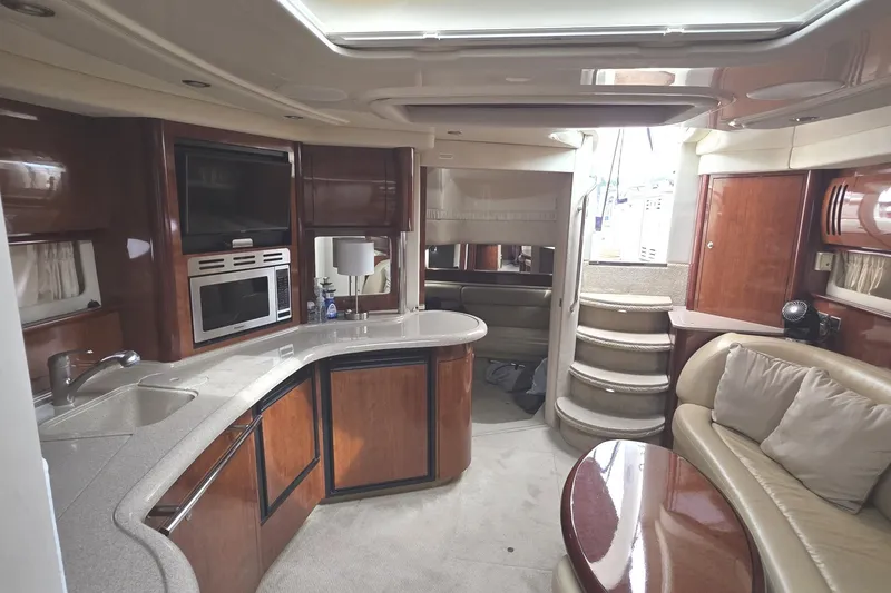 Slide: The Image of Luxurious interior of 2004 Sea Ray 420 Sundancer yacht with modern amenities and elegant design. - 33