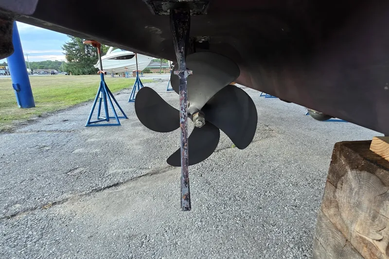 Slide: The Image of Propeller of a 2004 Sea Ray 420 Sundancer boat on dry dock. - 50