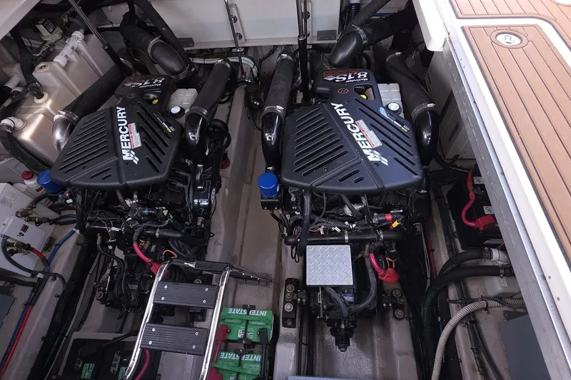 Slide: The Image of Engine room of 2004 Sea Ray 420 Sundancer with twin Mercury engines. - 45