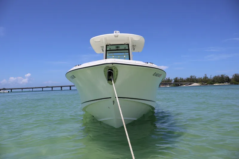 Slide: The Image of Boston Whaler 280 Outrage 2009 anchored in clear turquoise water, under a bright blue sky. - 2