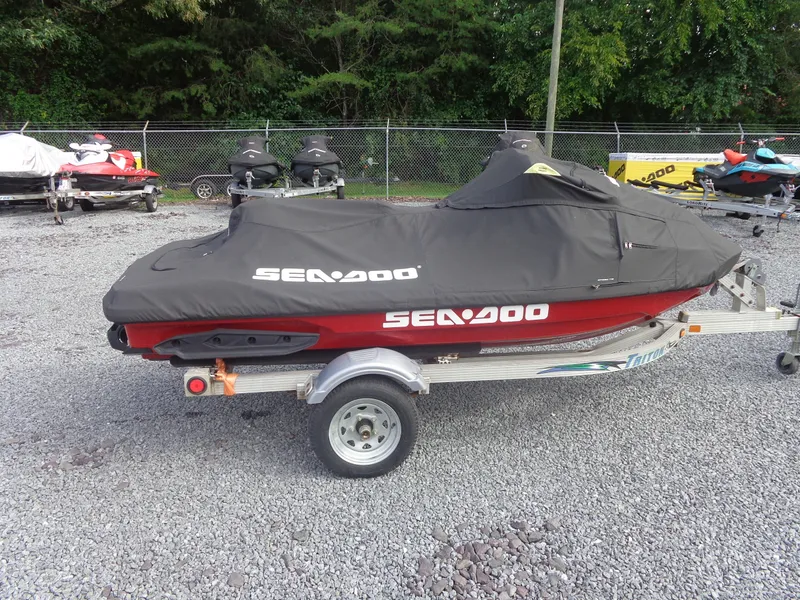 Slide: The Image of A 2024 Sea-Doo RXT-X 325 on a trailer, covered with a black tarp. - 29