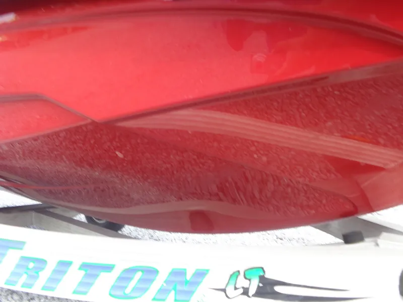 Slide: The Image of Close-up of a red Sea-Doo hull on a Triton trailer. - 27