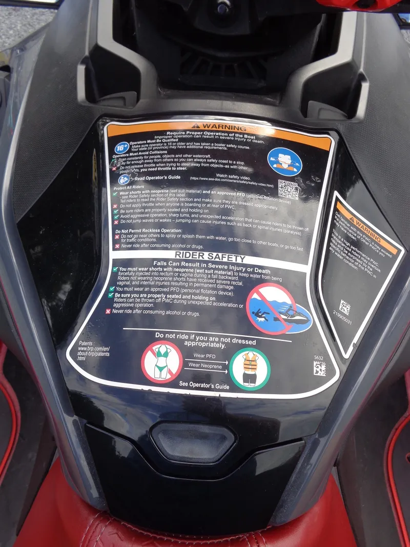Slide: The Image of Close-up of safety and warning labels on a 2024 Sea-Doo RXT-X 325. - 20