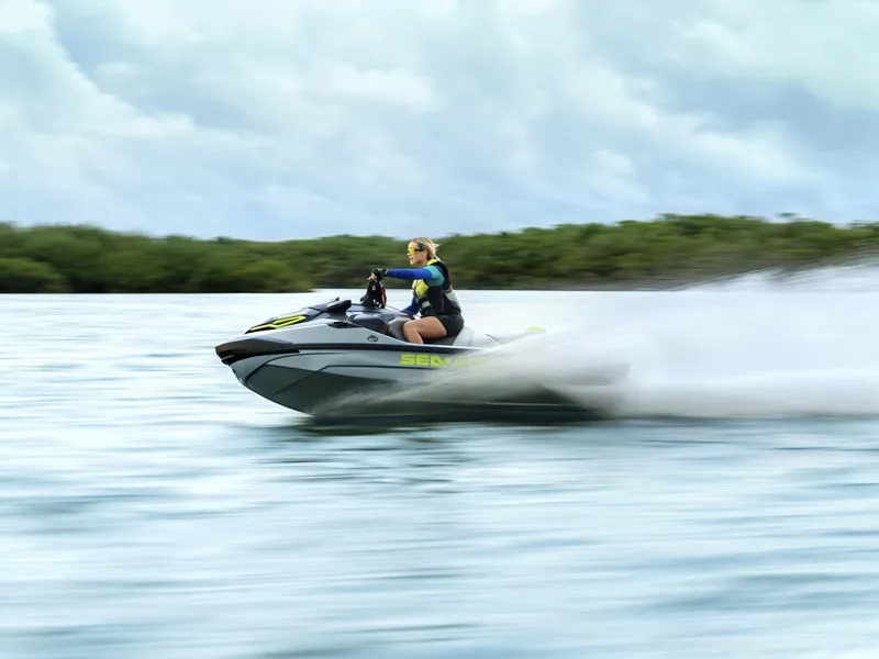 Slide: The Image of A person rides a Sea-Doo RXT-X 325 jet ski swiftly across the water. - 41