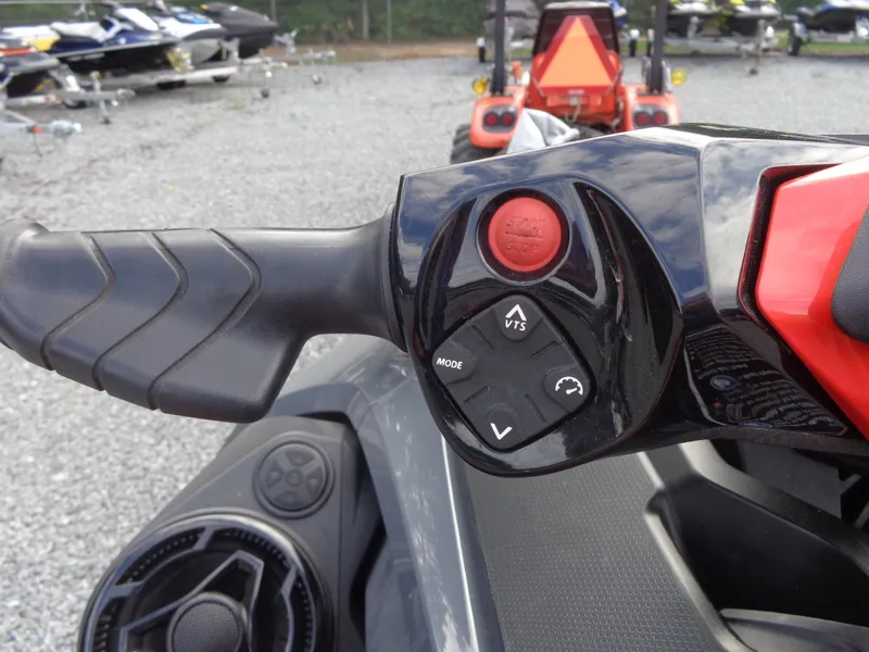 Slide: The Image of Close-up of the controls on a 2024 Sea-Doo RXT-X 325, featuring various buttons. - 23
