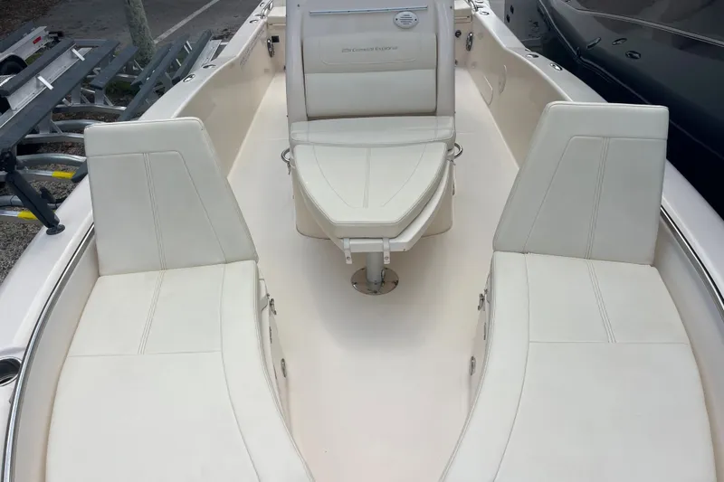 Slide: The Image of 2022 Grady-White 251 Coastal Explorer boat interior with white seating and clean design. - 17