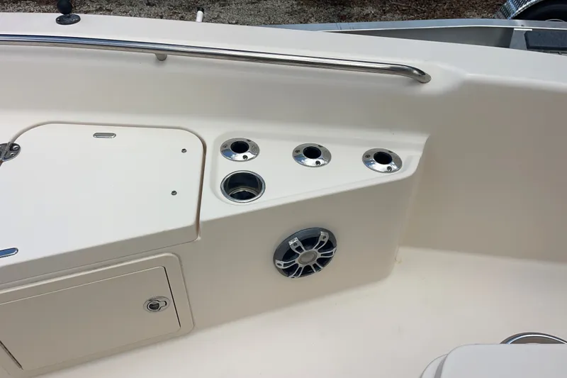 Slide: The Image of 2022 Grady-White 251 Coastal Explorer boat interior with rod holders and speaker. - 13