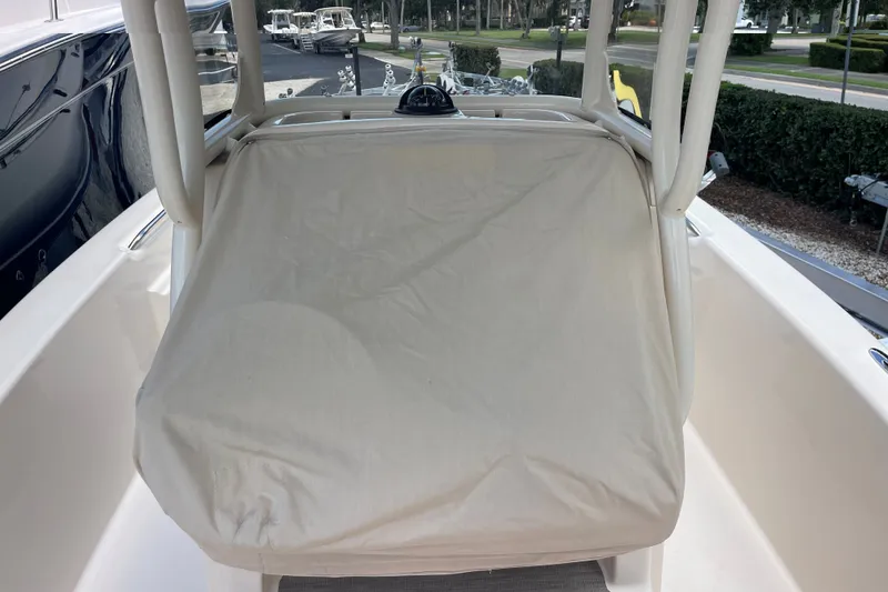 Slide: The Image of 2022 Grady-White 251 Coastal Explorer boat with covered console, docked outdoors. - 19