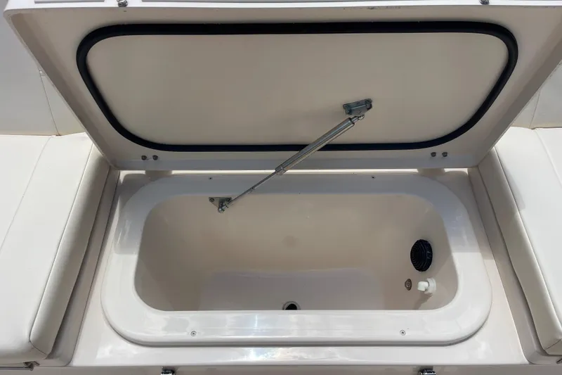 Slide: The Image of Open storage compartment on 2022 Grady-White 251 Coastal Explorer boat. - 14