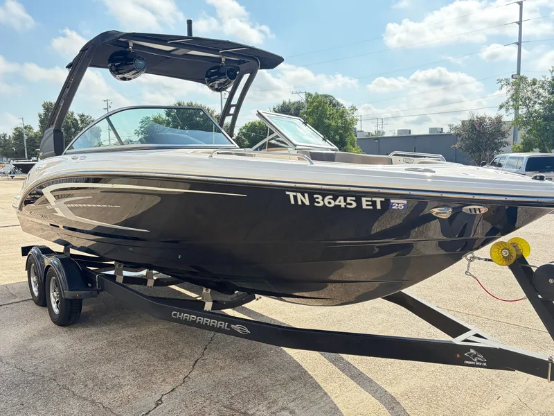 Slide: The Image of A 2021 Chaparral 23 SSi boat on a trailer, ready for use. - 3