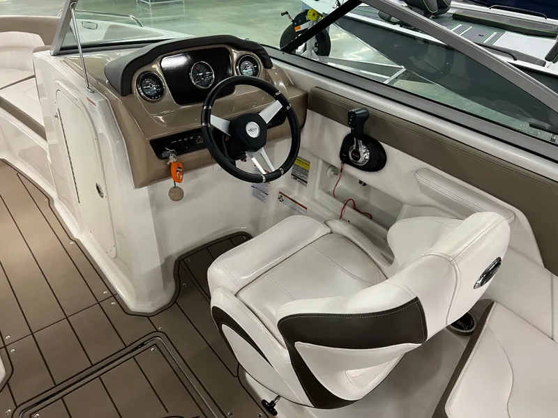 Slide: The Image of The image shows the cockpit of a 2021 Chaparral 23 SSi with a sleek steering wheel and comfortable seat. - 14