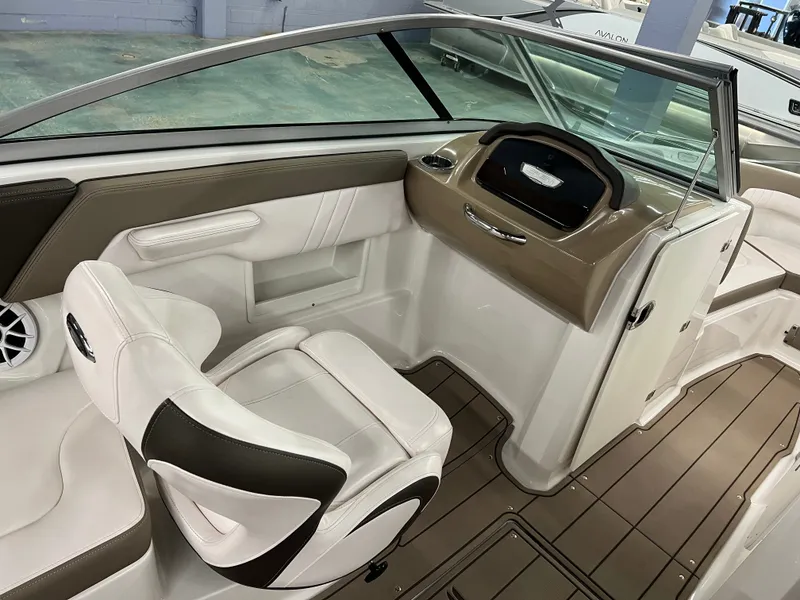 Slide: The Image of The image shows the cockpit of a 2021 Chaparral 23 SSi boat with sleek seating and a modern dashboard. - 15