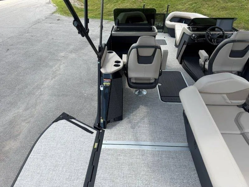 Slide: The Image of The image shows the interior of a modern boat with gray and black seating and a steering wheel. - 27