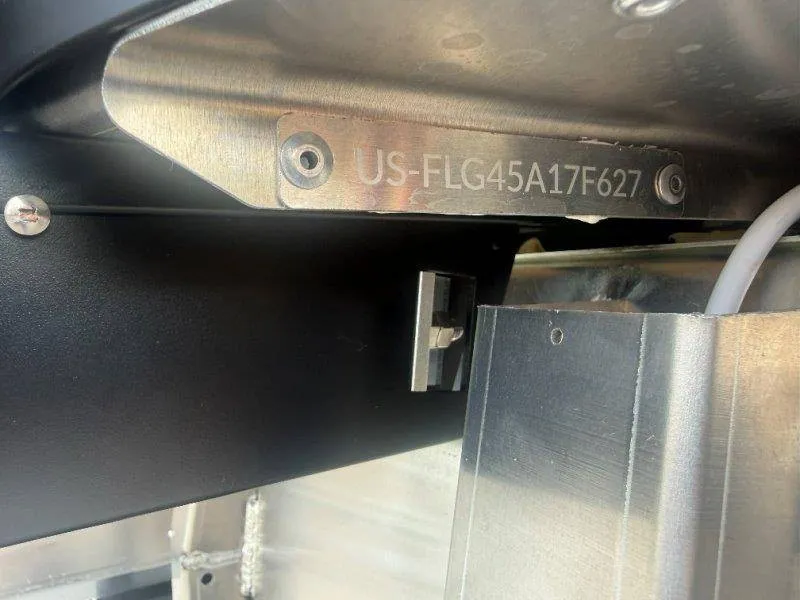 Slide: The Image of Close-up of a boat component with an engraved serial number. - 30