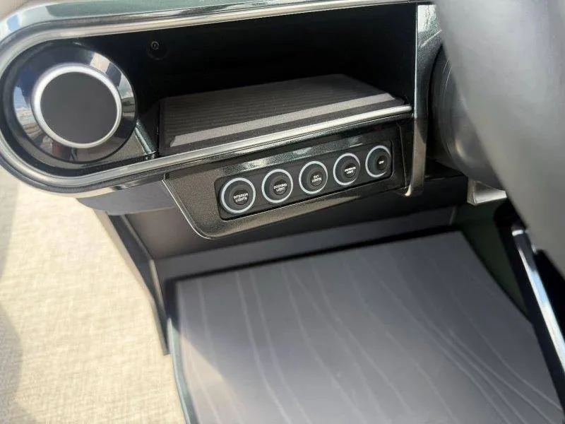 Slide: The Image of Close-up of a modern boat cockpit with sleek controls and a textured floor. - 35