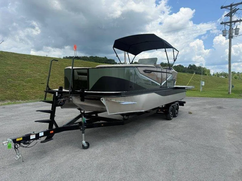 Slide: The Image of A 2027 Flamingo ROVE 245 boat on a trailer, featuring a black sunshade. - 19