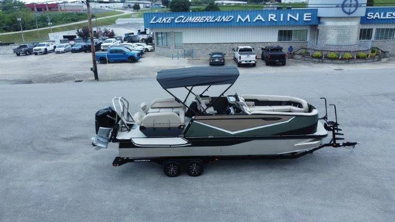 The Image of A 2027 Flamingo ROVE 245 boat on a trailer in front of a marine dealership. - 1