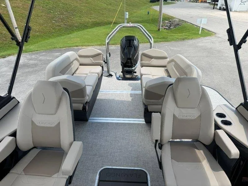Slide: The Image of The image shows the interior of a 2027 Flamingo ROVE 245 boat with beige seating. - 48