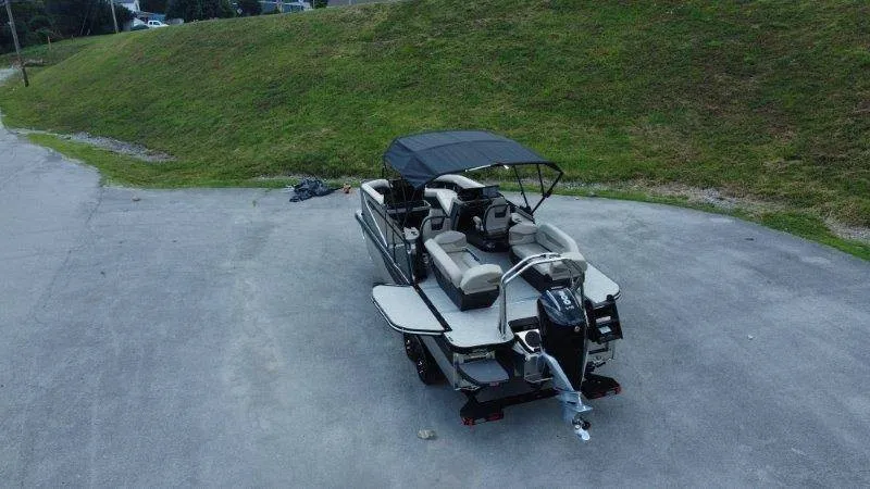 Slide: The Image of A Flamingo ROVE 245 boat from 2027 is on a trailer in a parking area. - 8
