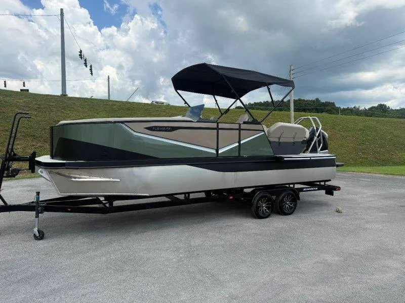 Slide: The Image of A 2027 Flamingo ROVE 245 on a trailer. It features a black canopy and sleek design. - 17