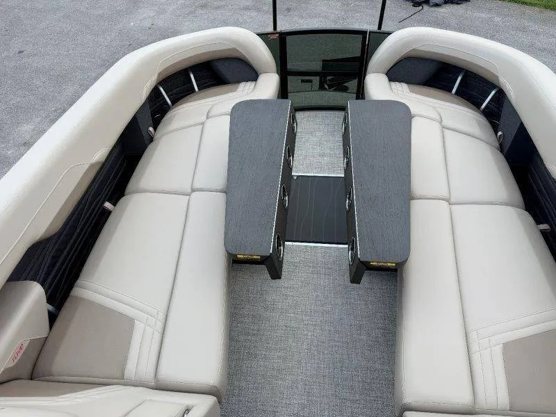 Slide: The Image of The image shows the interior of a 2027 Flamingo ROVE 245 boat with beige upholstery and a table. - 40