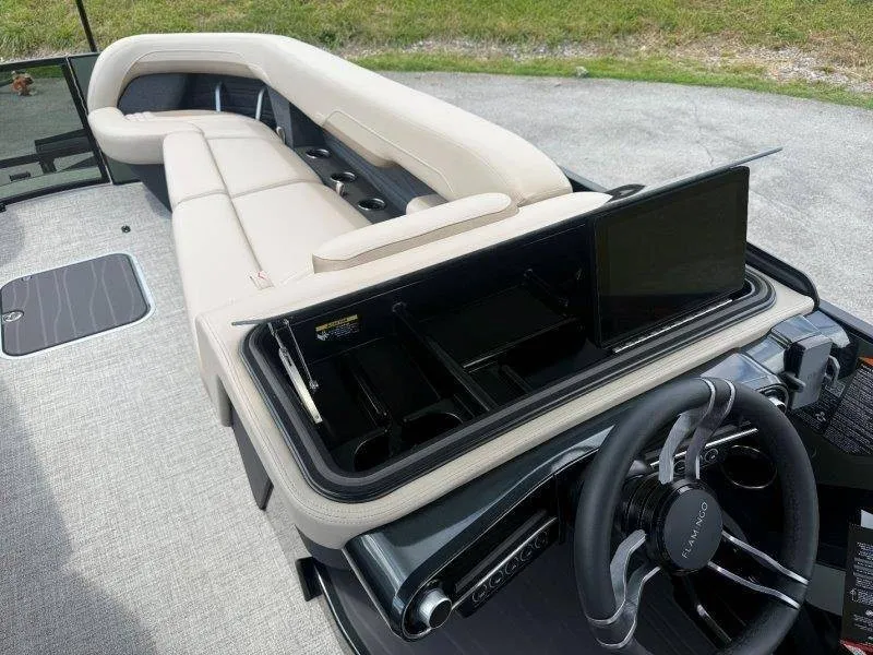Slide: The Image of The image shows the cockpit of a 2027 Flamingo ROVE 245 with a modern steering wheel and built-in screen. - 38