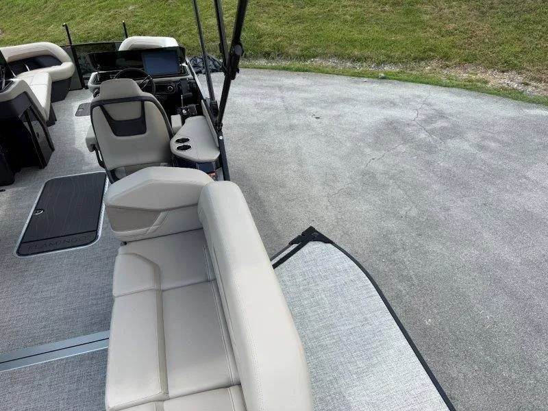 Slide: The Image of The image shows the cockpit of a 2027 Flamingo ROVE 245 boat with gray upholstery. - 41