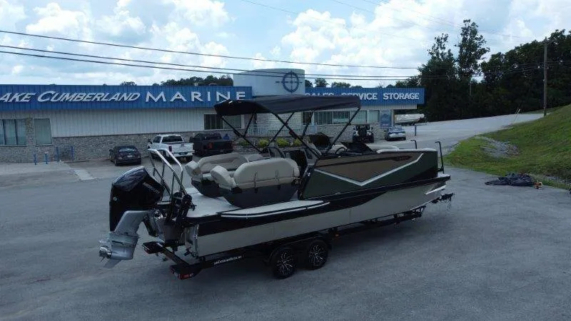 Slide: The Image of A 2027 Flamingo ROVE 245 on a trailer in front of a marine shop. - 10