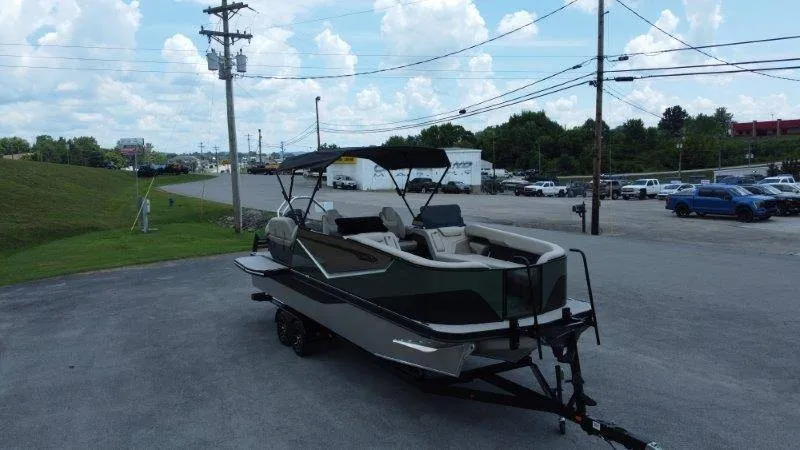 Slide: The Image of A 2027 Flamingo ROVE 245 boat on a trailer in a parking lot. - 13